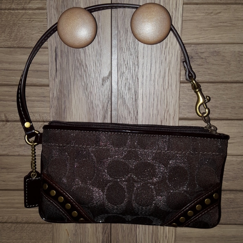 Coach dark brown metallic wristlet